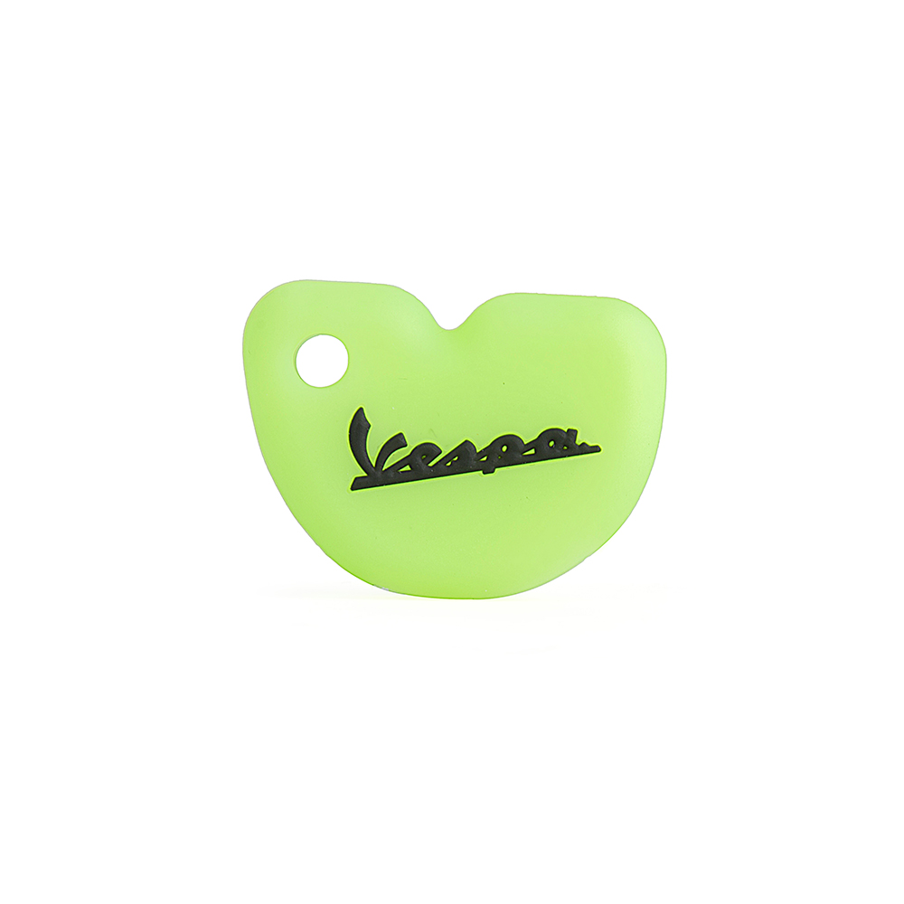 White Silicone Key Case on Green Background