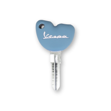 White Silicone Motorcycle Key Case on Light Blue Background