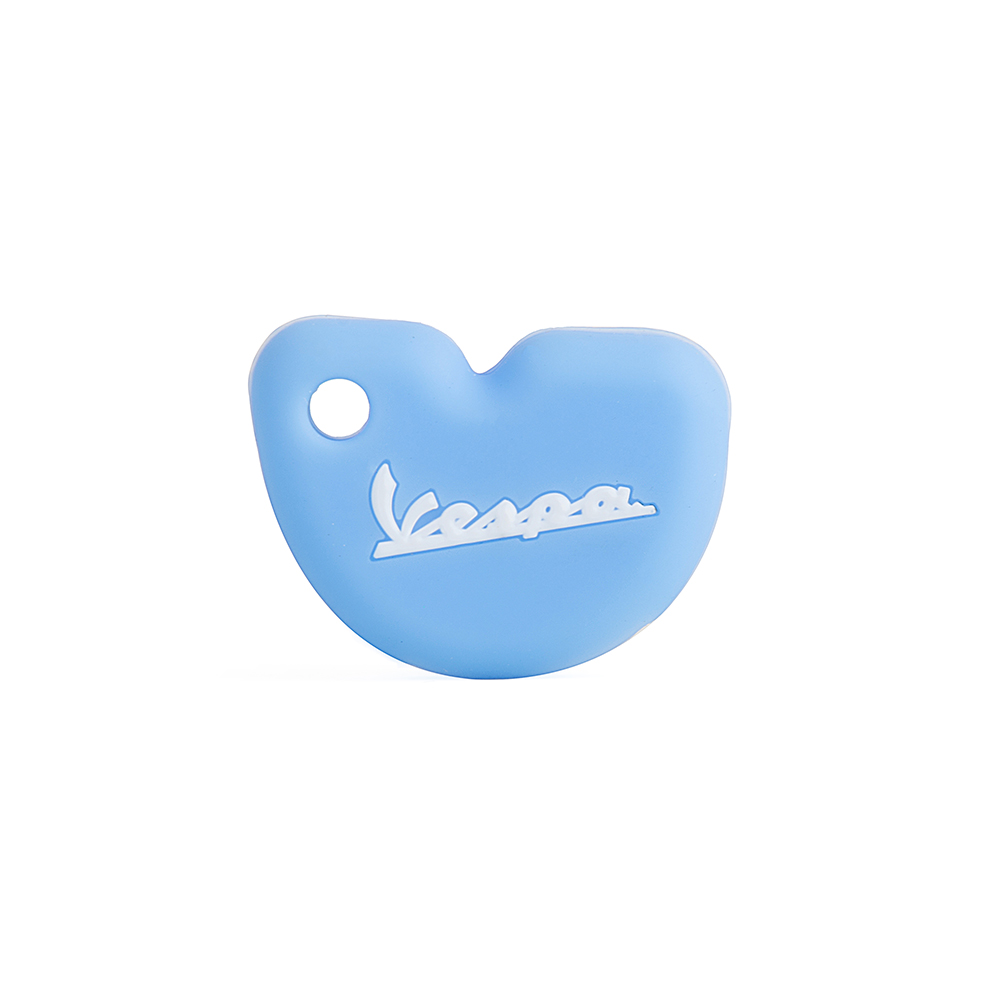 White Silicone Motorcycle Key Case on Light Blue Background